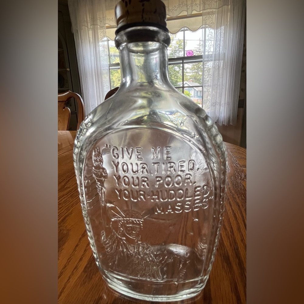 Log cabin vintage clear glass bottle without cap Statue of Liberty